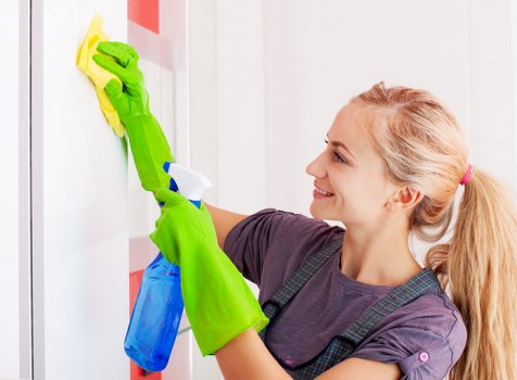 Detailed deep cleaning of a bright kitchen countertop and appliances